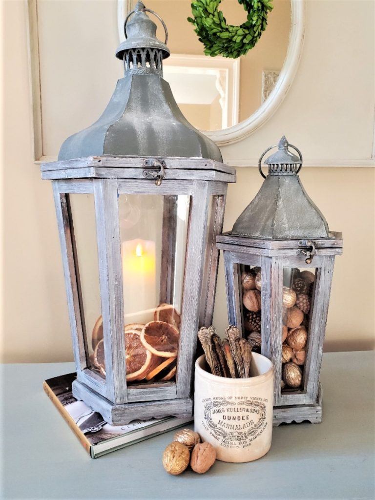 orange-and-candle-inside-lantern-decor-ideas