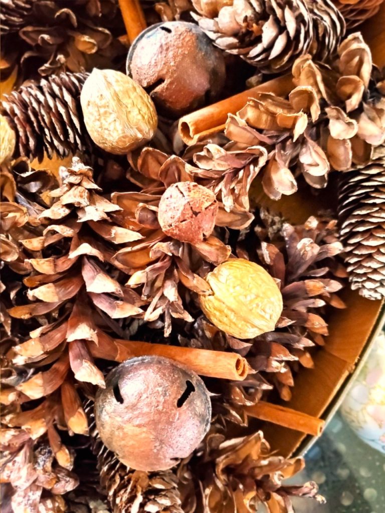 spice-up-rusty-jingle-bells-with-Mod-Podge-now-closer-look-at-smaller-bell-with-a-large-bell