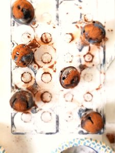 spice-up-rusty-jingle-bells-with-Mod-Podge now-cinnamon-drying