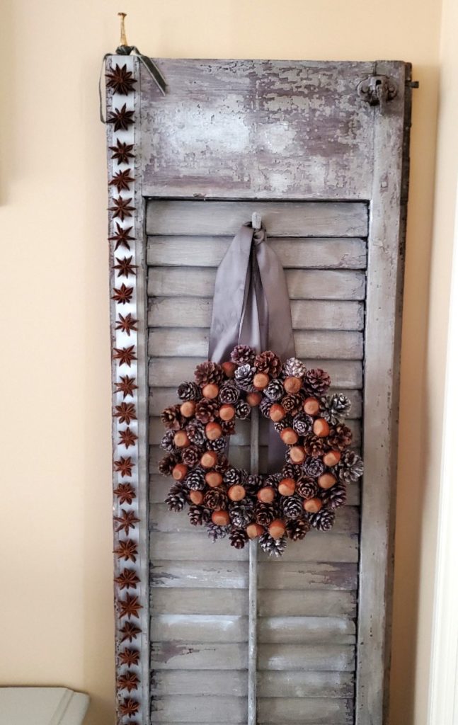 star-anise-garland-hanging-with-pinecone-wreath