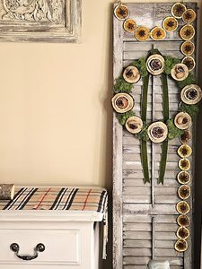 garland-hanging-from-shutter-with-a-wreath