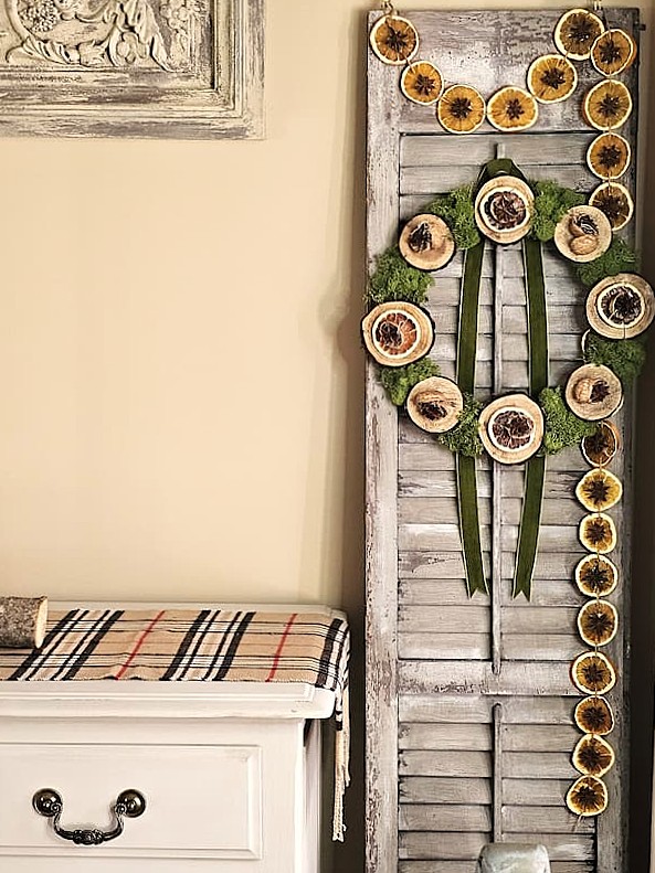 garland-hanging-from-shutter-with-a-wreath