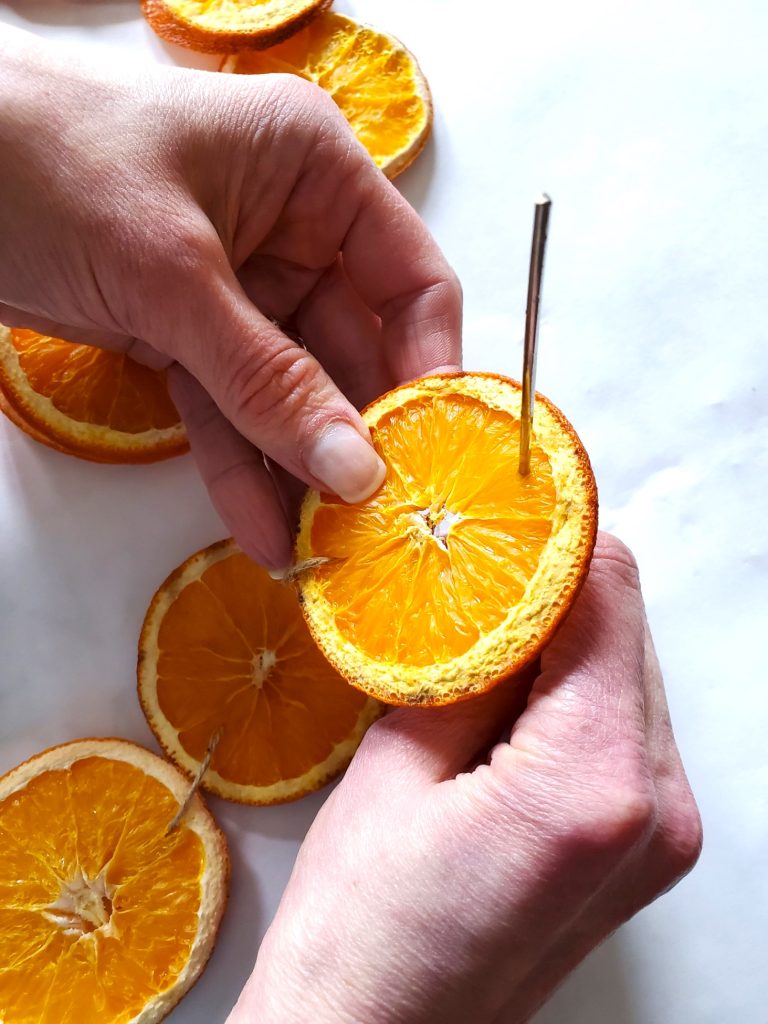 pushing-needle-in-orange