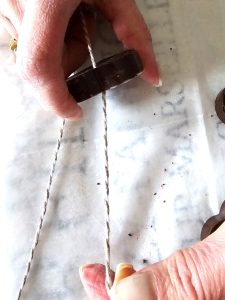 pulling-string-through-the-hole
