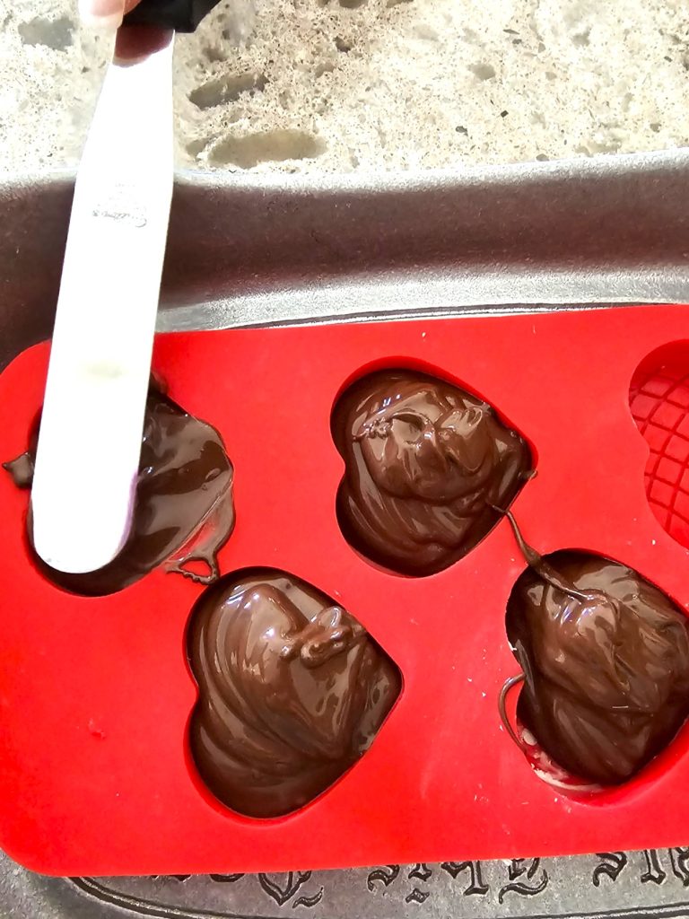 chocolate-valentine-heart-garland-smoothing-the-heart-top