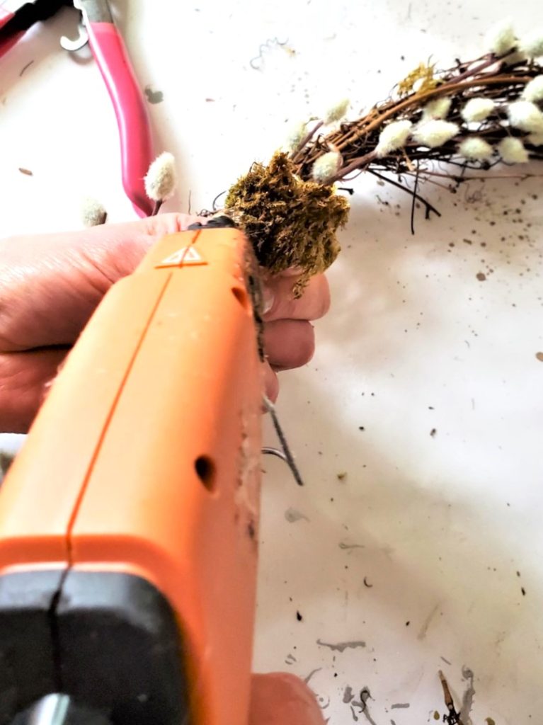 adding-hot-glue-to-moss