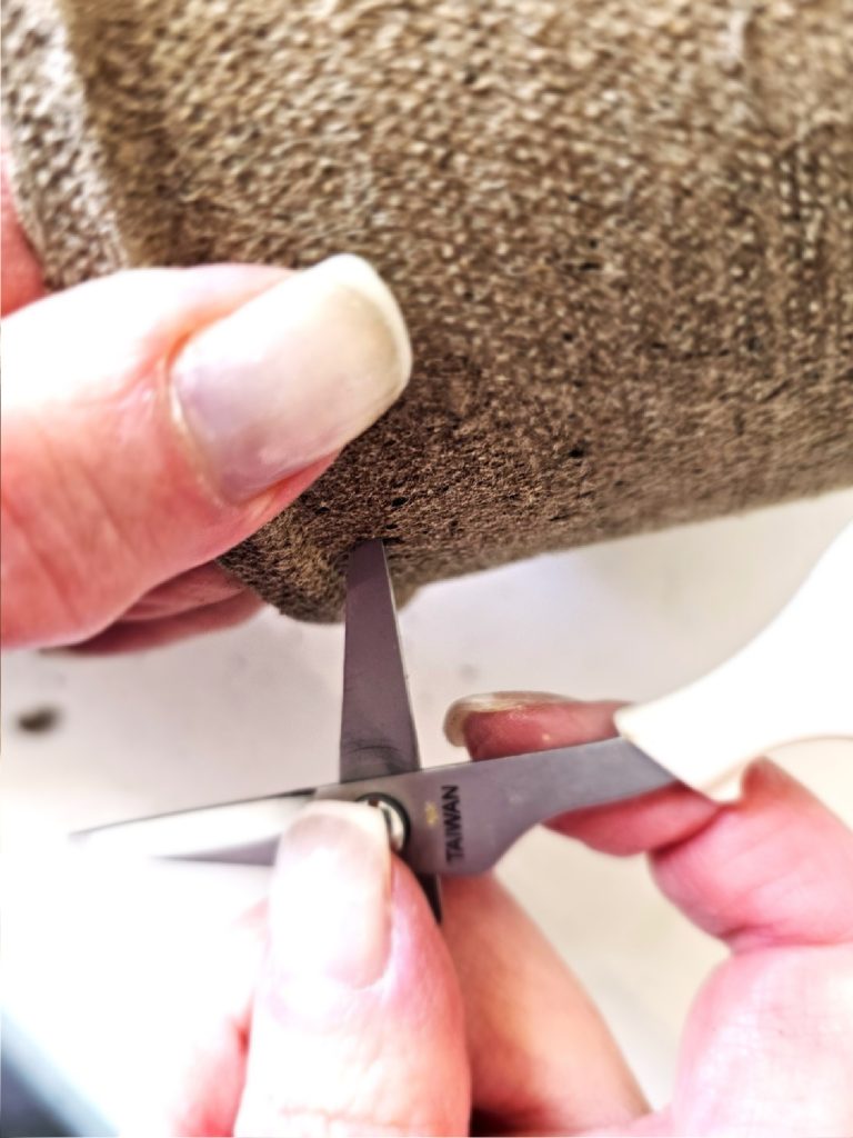 spring-peat-pot-treat baskets-making-a-hole-in-the-pot-with-scissor-tip
