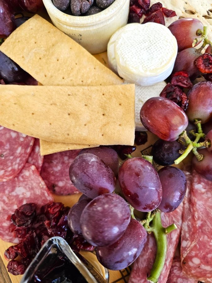 what-to-serve-with-a-charcuterie-board-today-brie-fruit-meat-featured-image