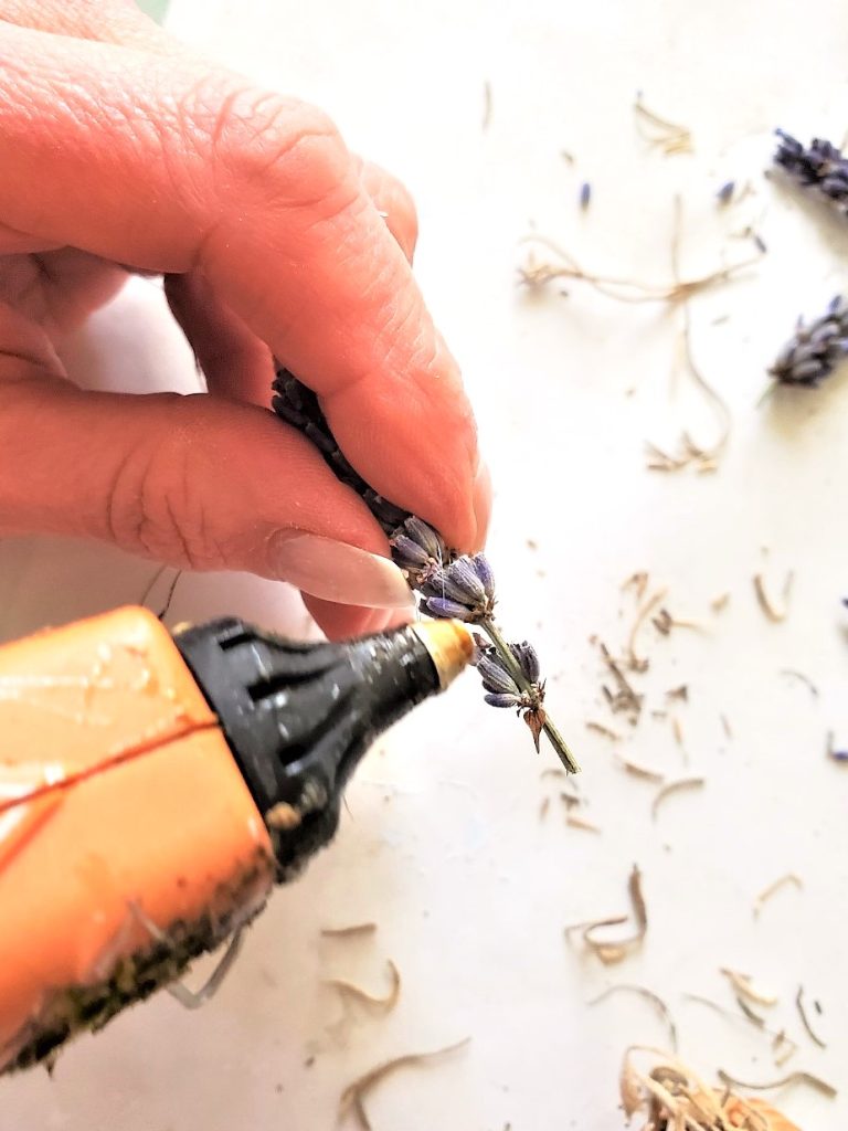 how-to-decorate-a-wire-wreath-frame-adding-glue-to-lavender