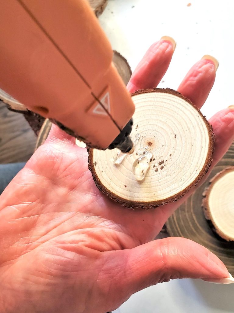 adding-glue-to-small-wood-round