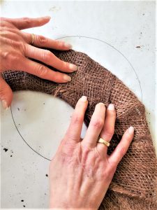 holding-burlap-to-set