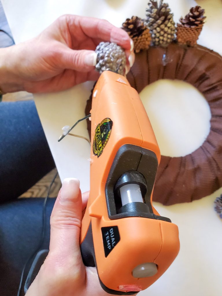 adding-glue-to-the-bottom-of-pinecone