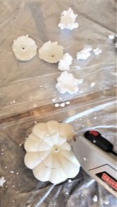 easy-pumpkin-candle-holders-in-four-steps-utility-knife-slicing-the-top-off-the-pumpkin