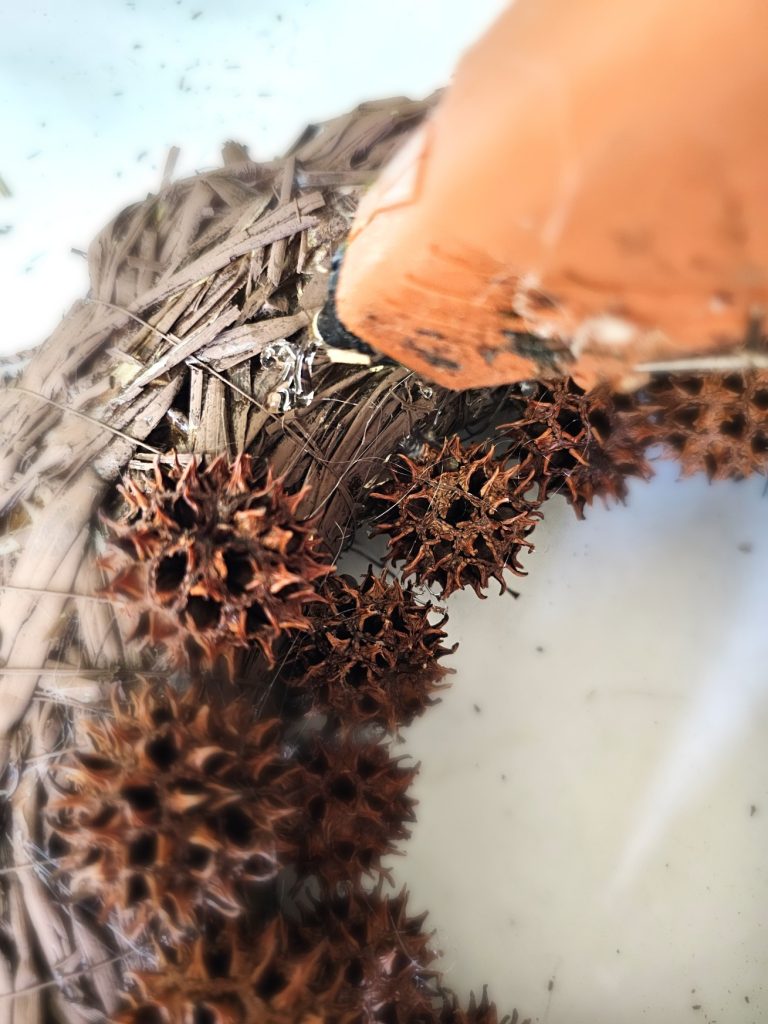 sweet-gum-ball-wreath-transform-your-decor-today-adding-glue-to-wreath-form