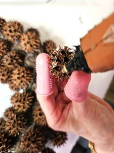 sweet-gum-ball-wreath-transform-your-decor-today-adding-glue-to-sweet-gum-ball