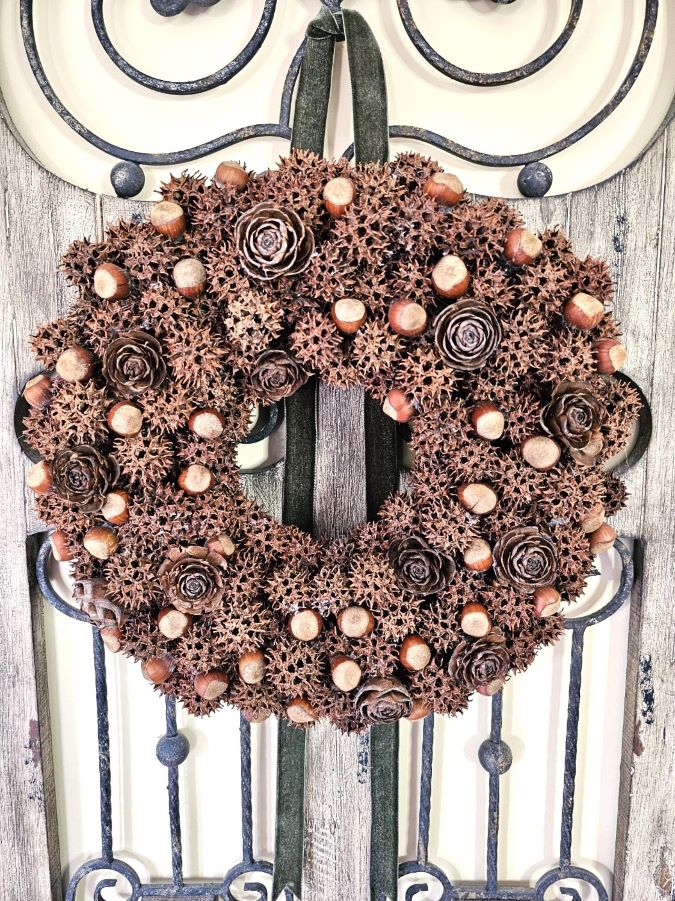 sweet-gum-ball-wreath-transform-your-decor-today-finished-wreath-hanging-featured-image