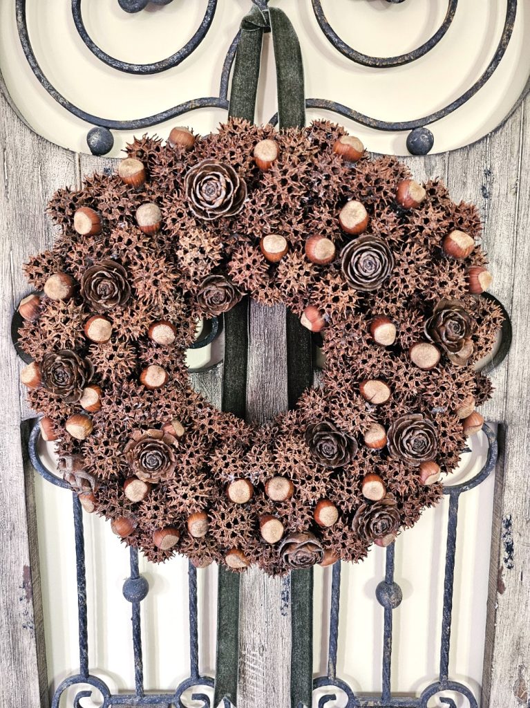 sweetgum-wreath-hanging-with-green-velvet-ribbon
