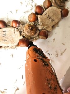 diy-fall-salt-dough-wreath-for-easy-cozy-decor-adding-glue-to-outer-edge-of-wreath-form
