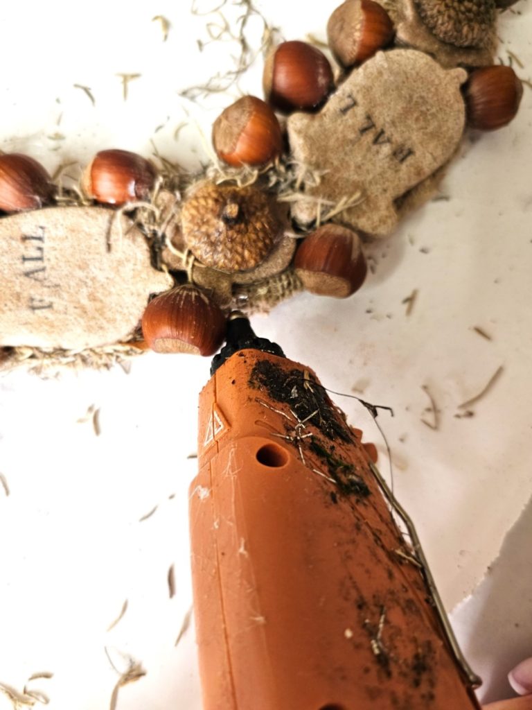 diy-fall-salt-dough-wreath-for-easy-cozy-decor-adding-glue-to-outer-edge-of-wreath-form