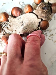 holding-moss-to-set-with-rubber-finger-protector-to-set