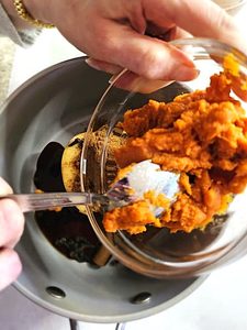 me-adding-canned-pumpkin