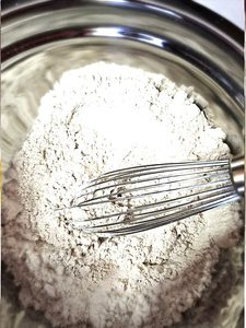 whisking-flour-salt-baking-powder-and-spices