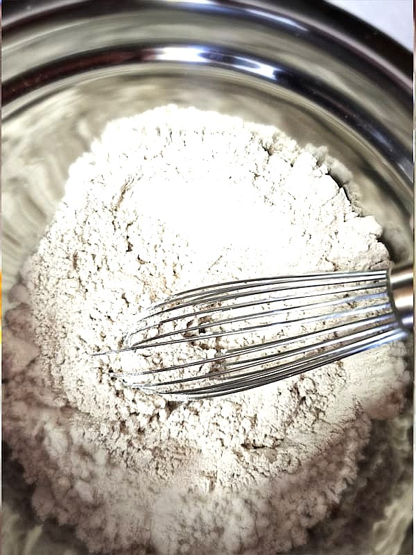 whisking-flour-salt-baking-powder-and-spices