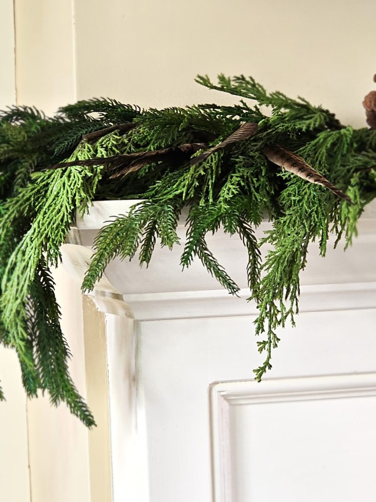 natural-christmas-decor-ideas-for-any-home-style-fireplace-mantle-greens-pheasant-feathers