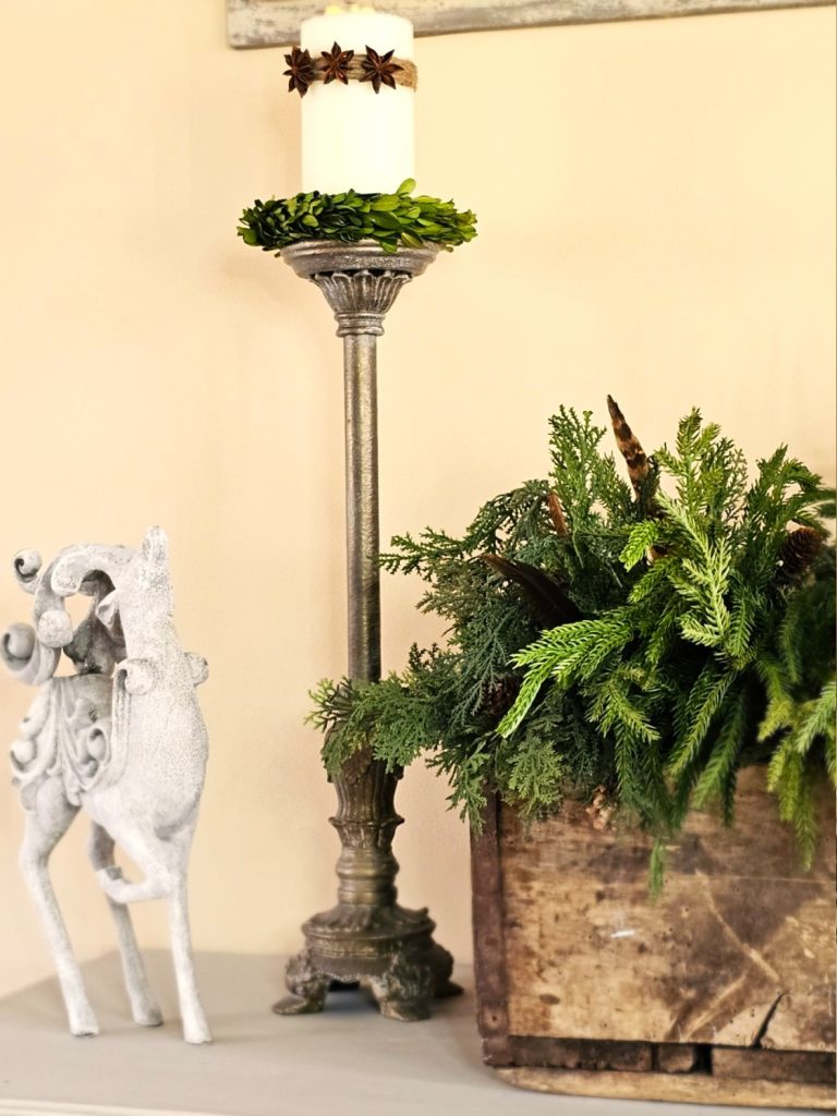 pillar-candle-wrapped-with-twine-three-star-anise-deer-crate-filled-with-greens