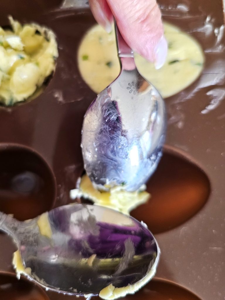 make-chive-butter-now-so-easy-adding-butter-to-mold-with-teaspoons