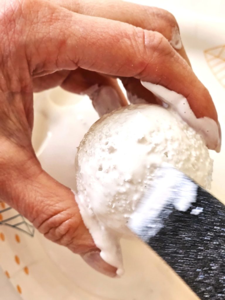adding-glue-with-a-sponge-brush-to-ball