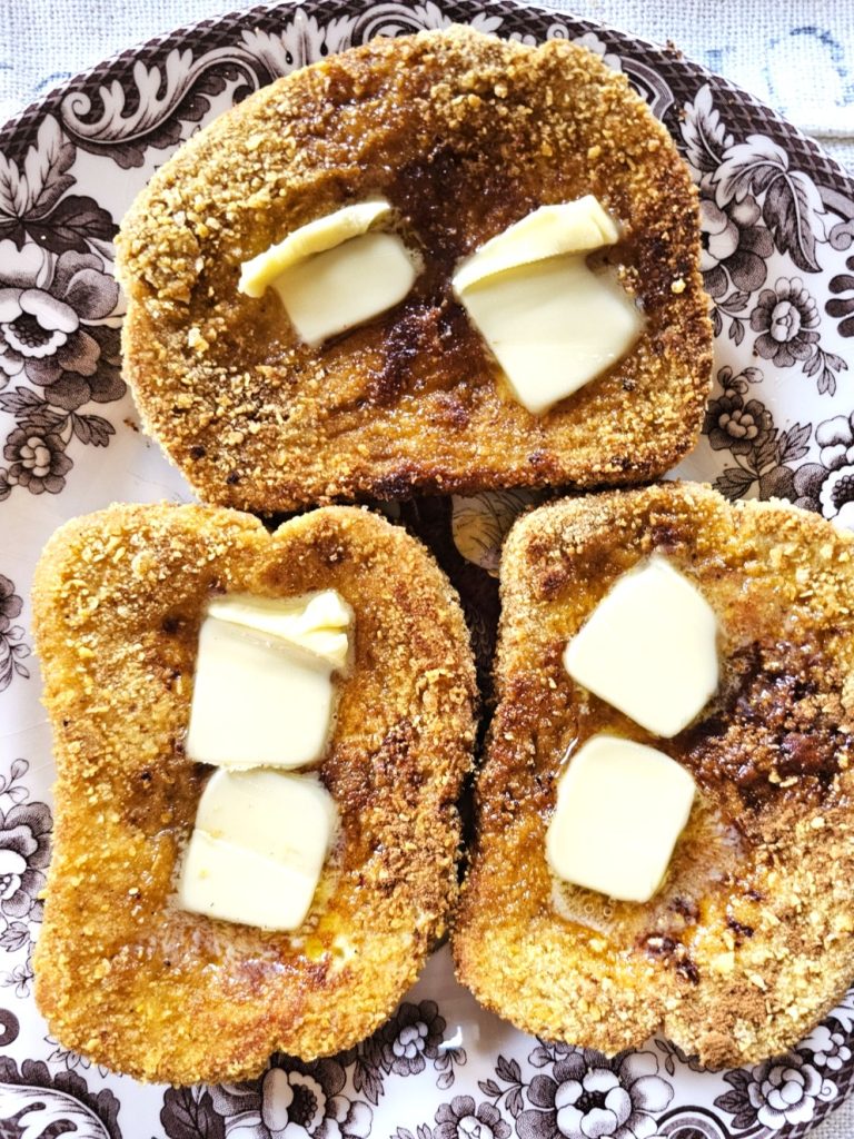 cornflake-french-toast-recipe-you-need-to-try-now-butter-on-the-french-toast-on-a-dish