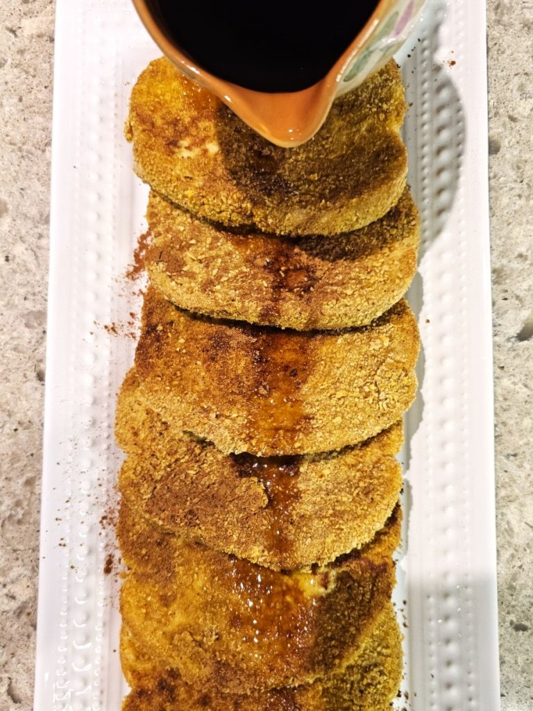 cornflake-french-toast-recipe-you-need-to-try-now-pouring-syrup-over-the-french-toast