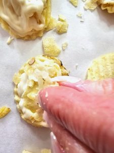 me-adding-broken-chips-on-top-of-drizzled-chocolate