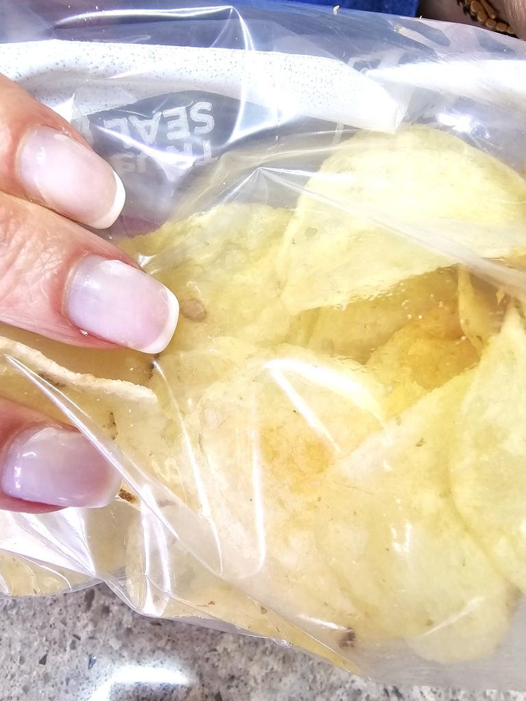 irresistible-chocolate-covered-chips-recipe-chips-in-bag-before-breaking-them-into-pieces