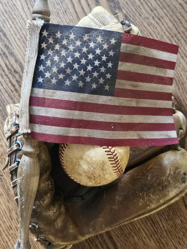 flag-dyed-displayed-on-a-basebll-glove-with-a-baseball