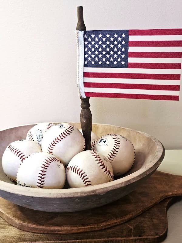 make-diy-vintage-spindle-american- flags-for-decor-flag-on-spindle-with-baseballs-in-a-wood-bowl