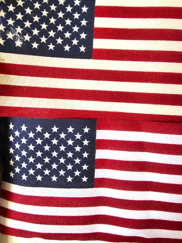 showing-flag-with-tea-stain-next-to-one-not-stained-with-tea