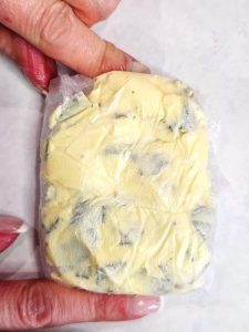 me-showing-flavored-butter-wrapped-in-plastic
