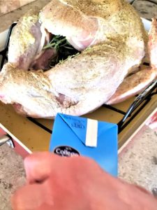 juicy-and-crispy-roast turkey-recipe-perfect-every-time-me-adding-stock-to-pan