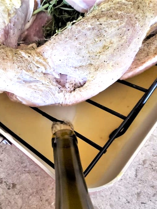 juicy-and-crispy-roast-turkey-recipe-perfect-every-time-me-adding-wine-to-pan