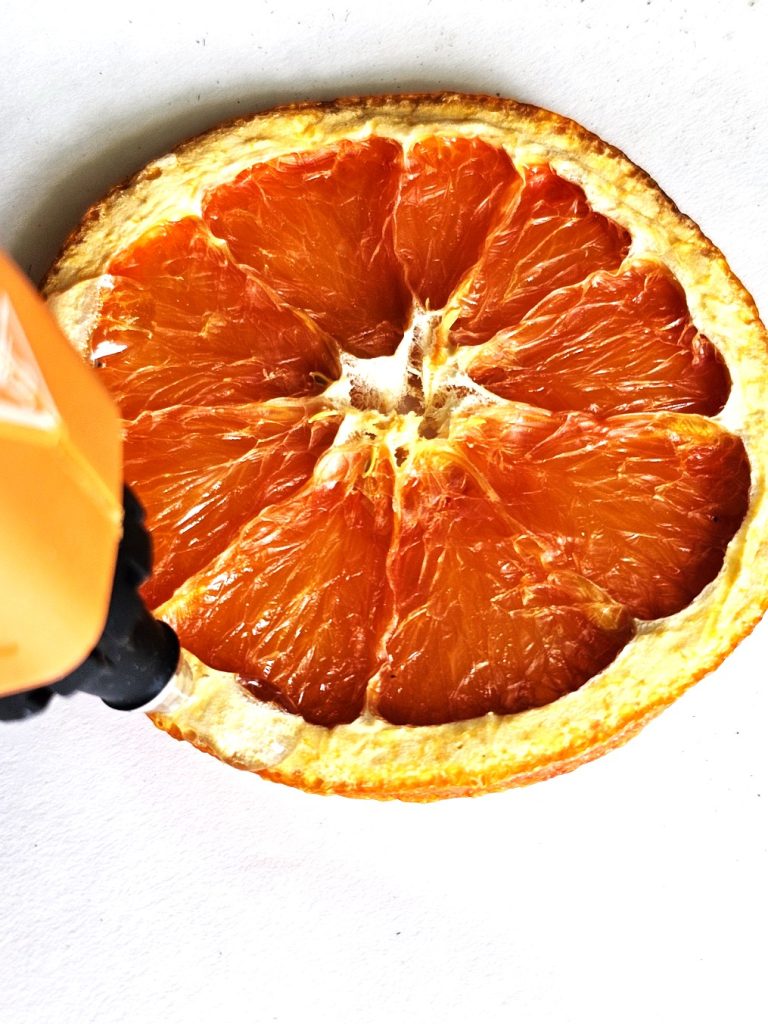 adding-glue-to-edge-of-orange