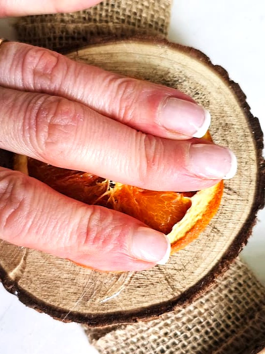 me-holding-orange-slice-to-set