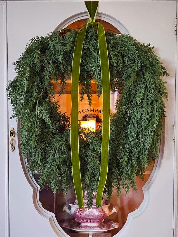 cozy-natural-Christmas-decorating-ideas-wreath-hanging-on-china-cabinet-door-featured-image