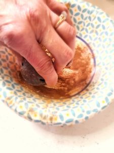 spice-up-jingle-bells-with-Mod-Podge-adding-cinnamon