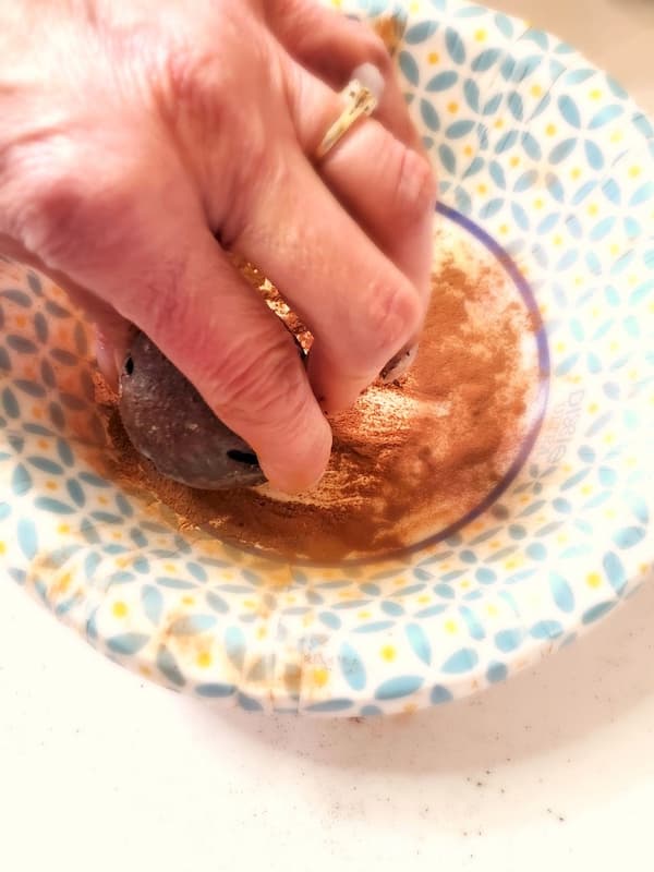 spice-up-jingle-bells-with-Mod-Podge-adding-cinnamon