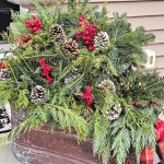 farmhouse- front-porch-christmas-decorating-ideas-copper-boiler-pot-filled-with-greens-and-berries-featured-image