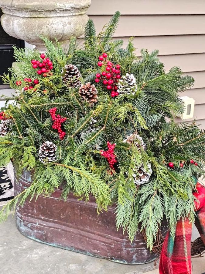 farmhouse- front-porch-christmas-decorating-ideas-copper-boiler-pot-filled-with-greens-and-berries-featured-image