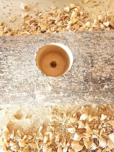 hole-drilled-into-log