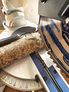 saw-going-through-log